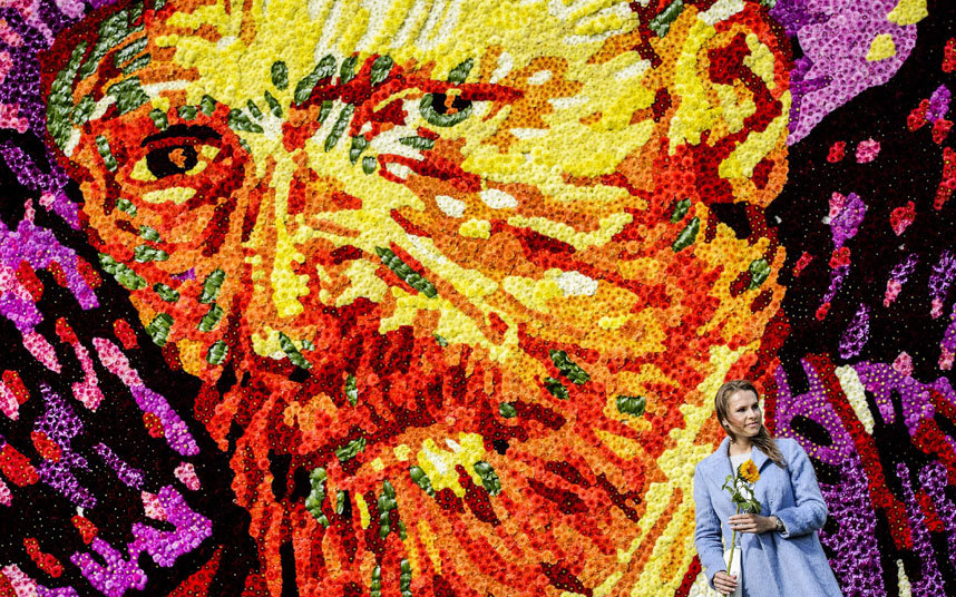 A tableau of flowers representing the face of famous Dutch painter Vincent van Gogh is revealed at Museumplein, Amsterdam, the Netherlands.